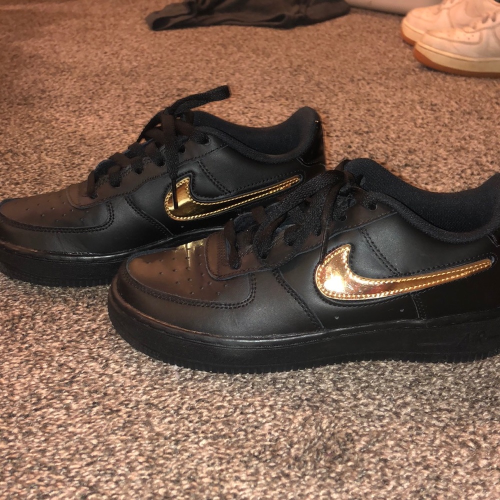Black airforce ones with gold nike logo velcro